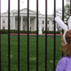 6 year old Rachel Kelmartin stands in front of the White House after learning the annual Easter Egg Roll on the South Lawn was cancelled due to rain, April 16, 2000. Photo via Getty Images.